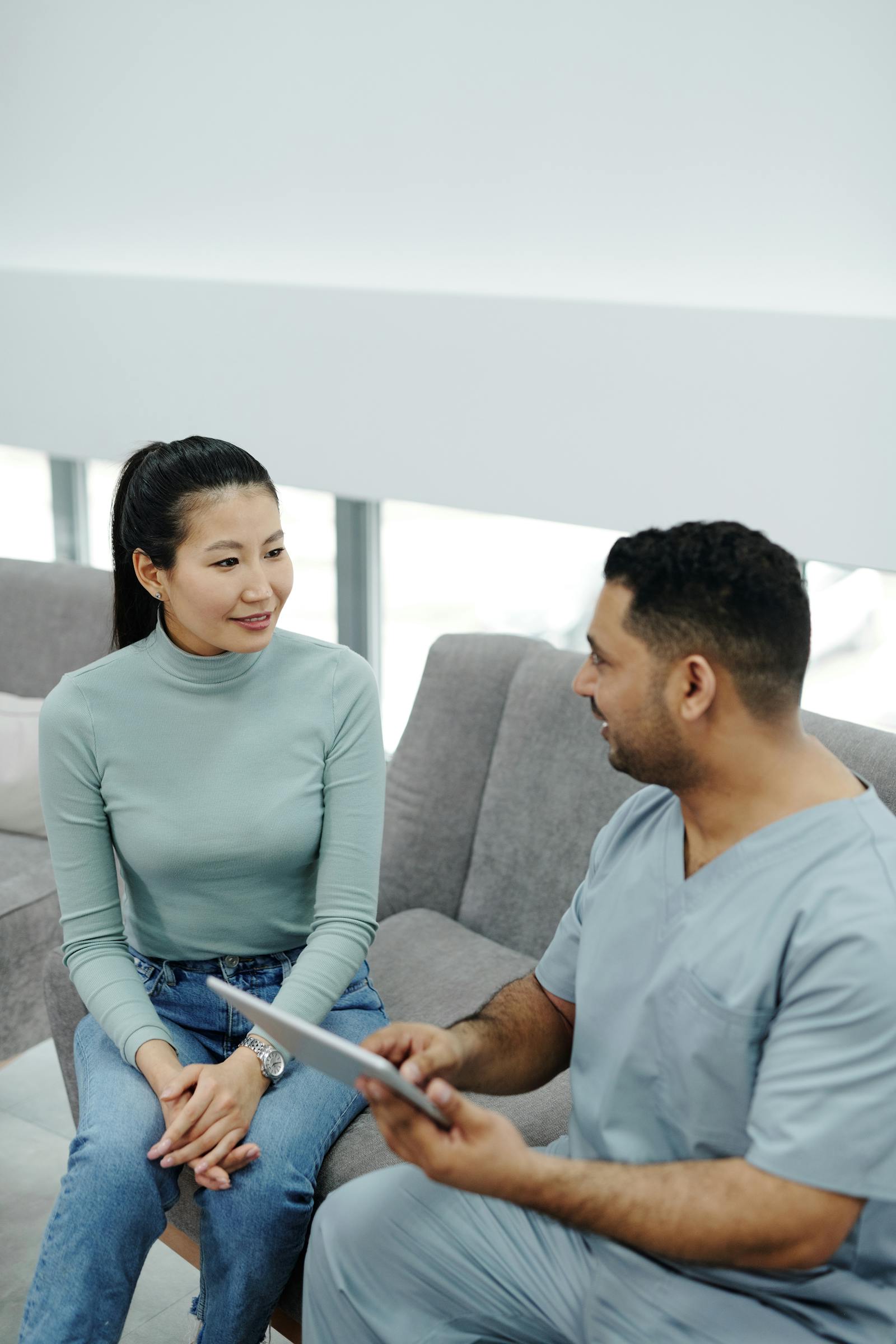 A doctor and patient in conversation during a healthcare consultation.